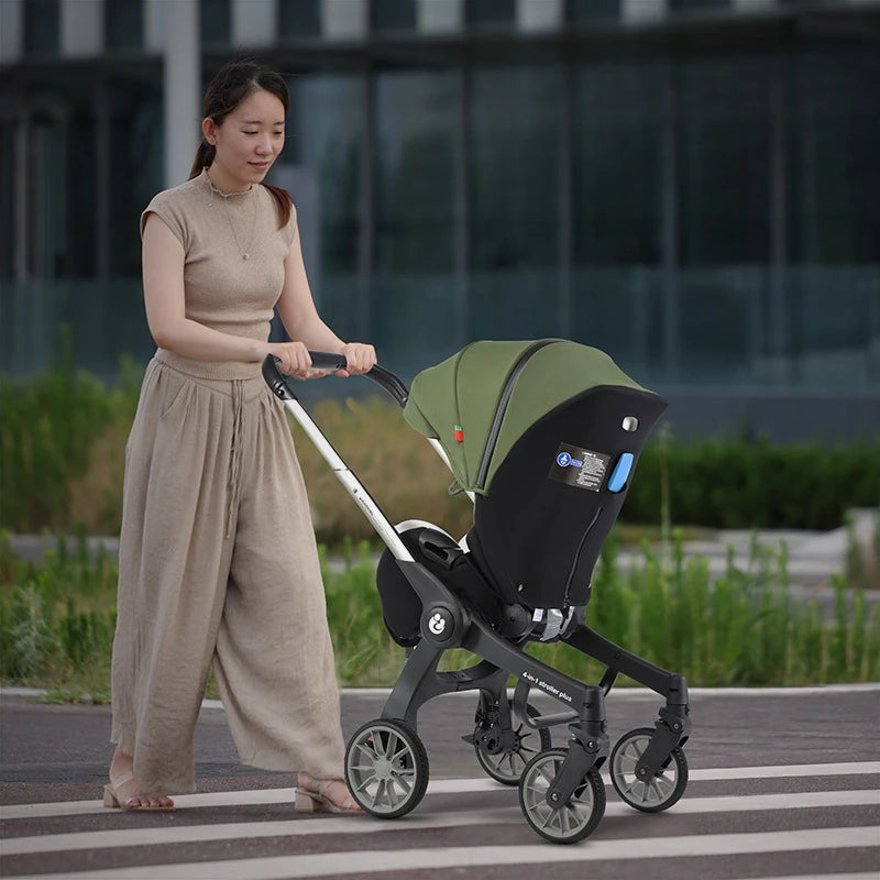 Mom with her baby in 4-in-1 baby two-way stroller 